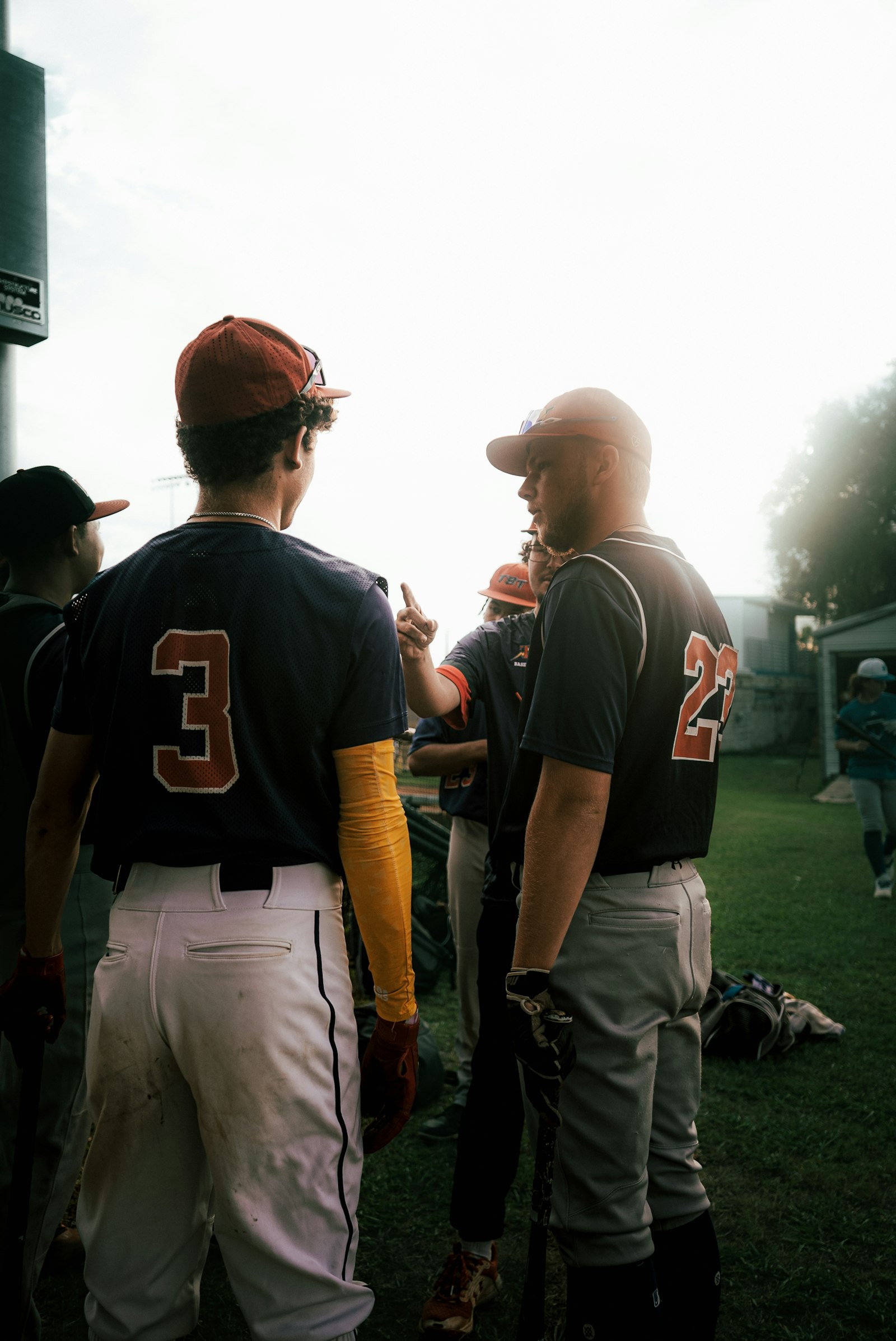 Youth baseball player receiving one-on-one coaching instruction