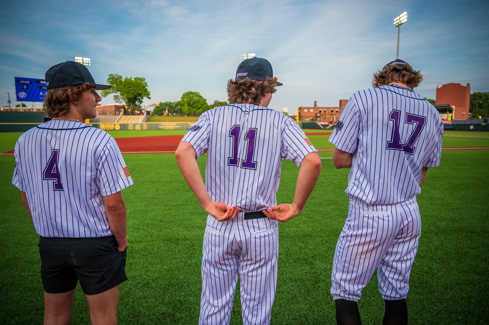 Young baseball players on the field before a game — photo by Unsplash